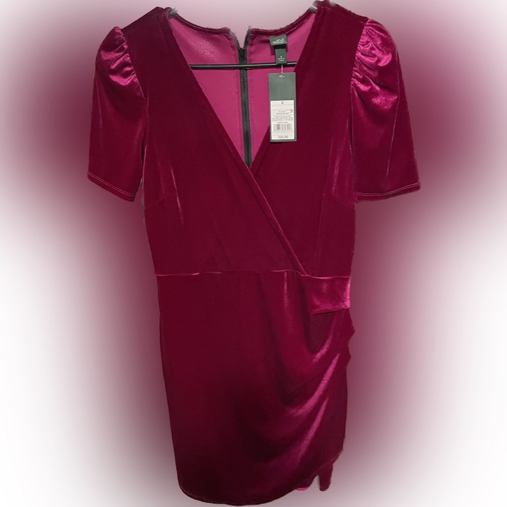 Fuchsia, velvet dress that goes just above the knee.